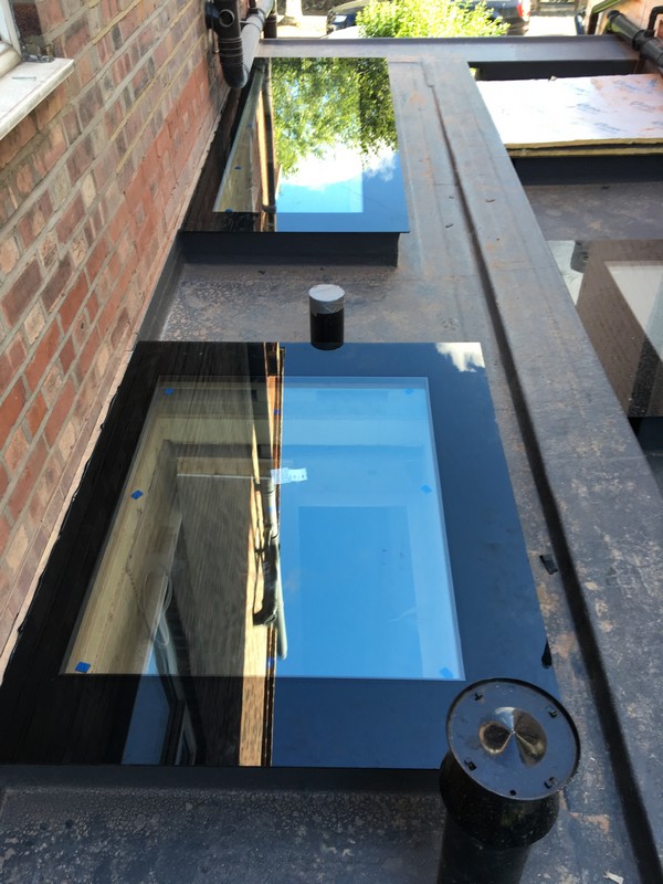 Multiple flat roof skylights on extension in Kensington